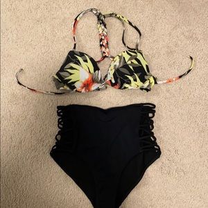 Floral bikini top with high-waisted black bottoms